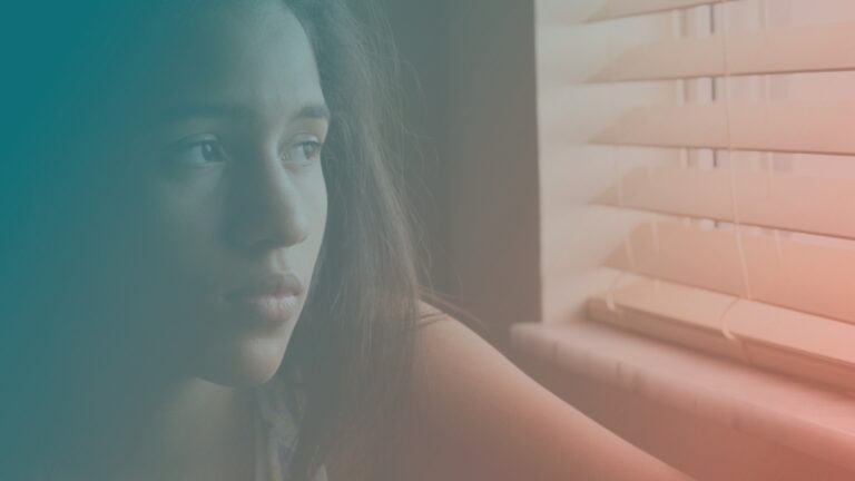 Sad woman staring out the window