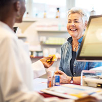 Woman paying for prescription